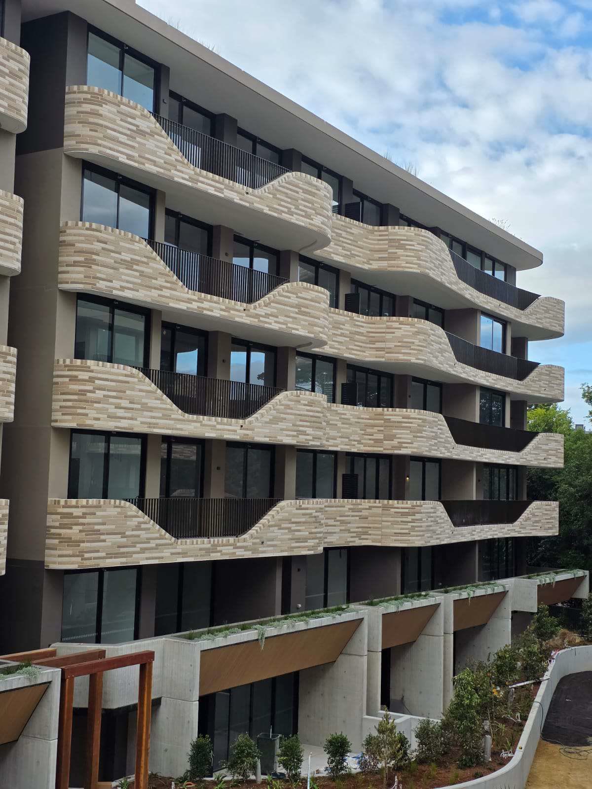 Apartment building facade with glazing and feature balconies