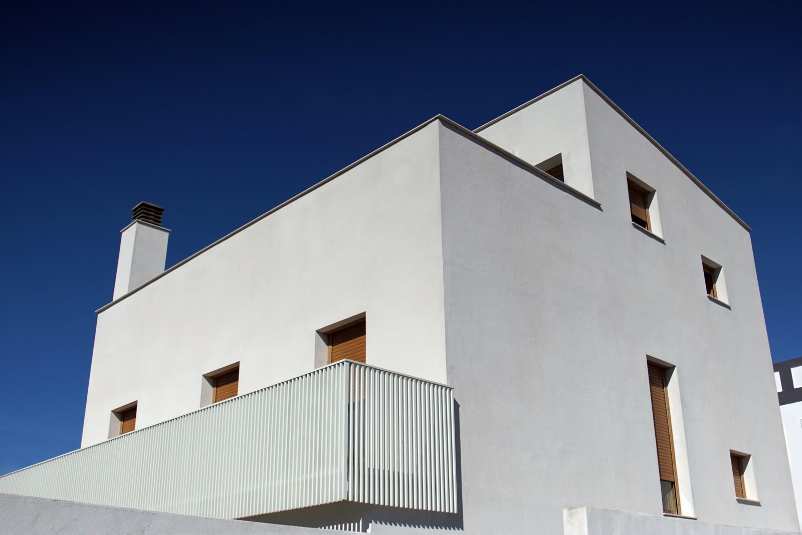 Modern home with smooth white rendered walls